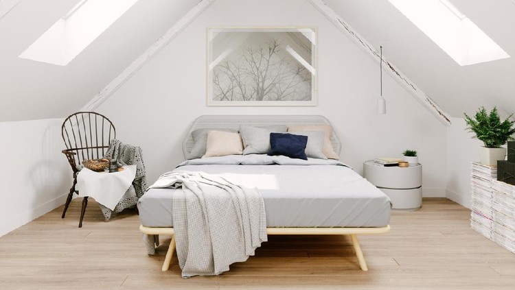 Interior of a Scandinavian style attic bedroom.