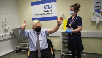 Britain's Prime Minister Boris Johnson receives the first dose of the AstraZeneca vaccine administered by nurse and Clinical Pod Lead, Lily Harrington at St. Thomas' Hospital in London, Friday, March 19, 2021. Johnson is one of several politicians across Europe, including French Prime Minister Jean Castex, getting a shot of the AstraZeneca vaccine on Friday. (AP Photo/Frank Augstein, Pool)