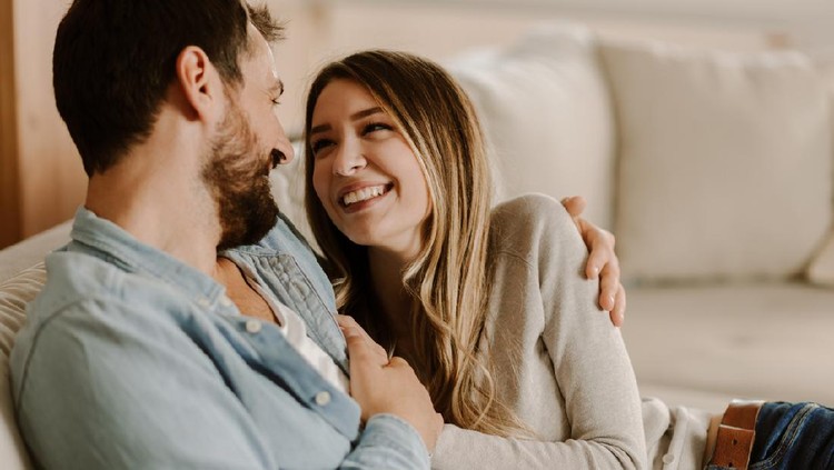 1183622100 Loving happy couple talking to each other at home