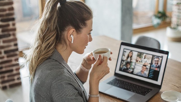 Women at home during pandemic isolation have conference  call