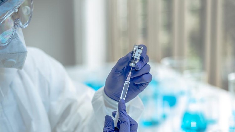 Ilustrasi Vaksin Nusantara Scientists are done research on vaccine in laboratory with test tubes on Covid19 Coronavirus type for discover vaccine.