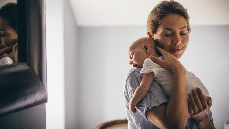 Worried young foster care parent mother comforting solacing embrace adopted little child daughter give care and protection at home, loving concerned adult mom hug sad small girl consoling kid concept