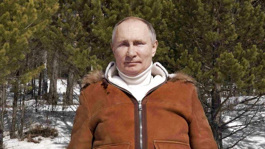 In this photo made available on Sunday, March 21, 2021, Russian President Vladimir Putin poses for a photo in a taiga forest in Russia's Siberian region. Putin and Russia Defense Minister Sergei Shoigu are spending the weekend in Siberia said Kremlin spokesman Dmitry Peskov. (Alexei Druzhinin, Sputnik, Kremlin Pool Photo via AP)