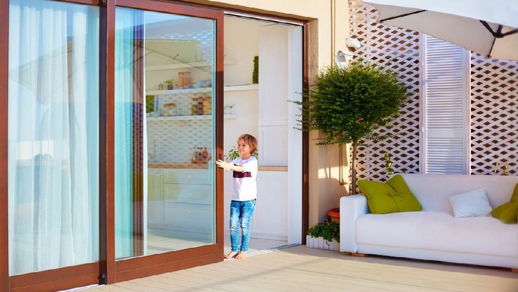 Ilustrasi Pintu Rumah Minimalis happy young boy, kid opening the sliding door on rooftop patio area at home