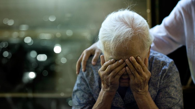 The daughter is comforting an elderly woman who is a mother sadness with Alzheimer's disease and amnesia, Memory loss due to dementia.