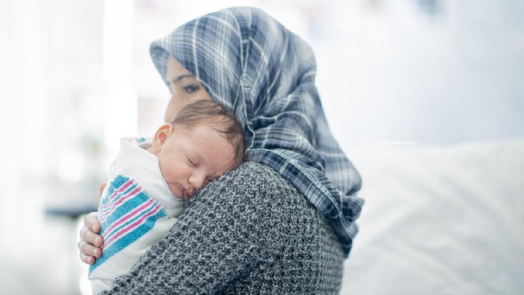 Islamic mother and newborn baby in the hospital.