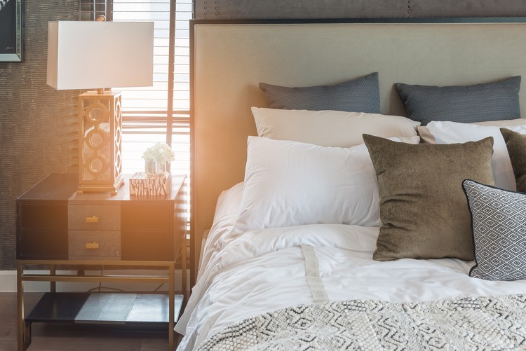 luxury bedroom style with set of pillows on bed, interior decoration design concept
