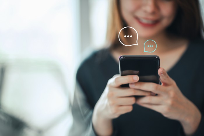 Women's hand typing on mobile smartphone, Live Chat Chatting on application Communication Digital Web and social network Concept. Work from home. Women's hand typing on mobile smartphone, Live Chat Chatting on application Communication Digital Web and social network Concept. Work from home.