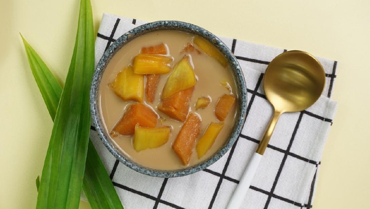 Kolak Ubi Nangka, Indonesian dessert, made from Sweet potato and Jack fruit cooked with palm sugar, coconut milk, pandanus leaves. Very popular during Ramadhan. Clean Yellow background