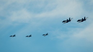 SOUTH CHINA SEA (April 6, 2021) – Aircraft from Carrier Air Wing (CVW) 11 fly above the aircraft carrier USS Theodore Roosevelt (CVN 71) April 6, 2021. The Theodore Roosevelt Carrier Strike Group is on a scheduled deployment to the U.S. 7th Fleet area of operations. As the U.S. Navy's largest forward-deployed fleet, 7th Fleet routinely operates and interacts with 35 maritime nations while conducting missions to preserve and protect a free and open Indo-Pacific Region. (U.S. Navy photo by Mass Communication 3rd Class Dartañon D. De La Garza)
