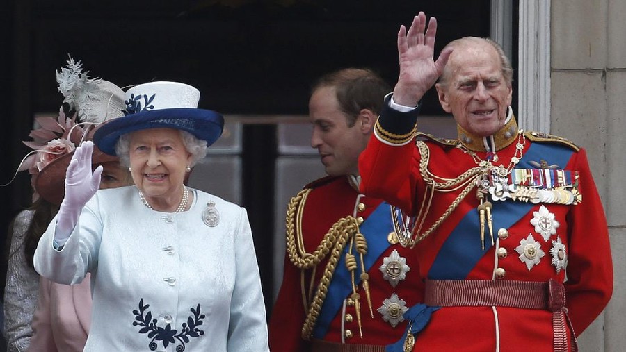 FILE - In this Saturday, June 14, 2014 file photo, Britain's Queen Elizabeth II, accompanied by Prince Philip, wave to the crowds from the balcony of Buckingham Palace, during the Trooping The Colour parade, in central London. Prince Philip was the longest serving royal consort in British history. In Britain, the husband or wife of the monarch is known as consort, a position that carries immense prestige but has no constitutional role. (AP Photo/Lefteris Pitarakis, File)