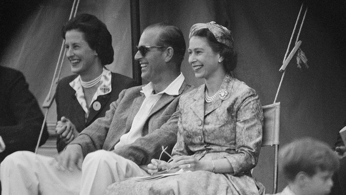 Queen Elizabeth II and Prince Philip, Duke of Edinburgh watch a cricket match at Highclere Castle, Highclere, Hampshire, 3rd August 1958.  (Photo by Victor Blackman/Daily Express/Hulton Archive/Getty Images)