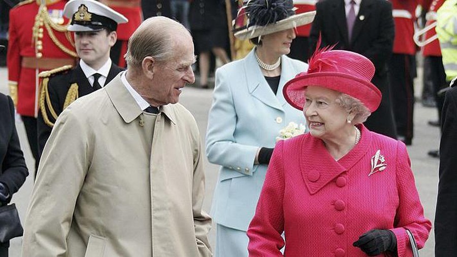WINDSOR, UNITED KINGDOM - APRIL 21:  Queen Elizabeth II and Prince Philip, Duke of Edinburgh smile at each other on April 21, 2006 in Windsor, England. HRH Queen Elizabeth II is taking part in her traditional walk in the town to celebrate her 80th Birthday. In the evening the Prince of Wales will host a private party for The Queen and other members of the Royal family at Kew Palace.  (Photo by MJ Kim/Getty Images)