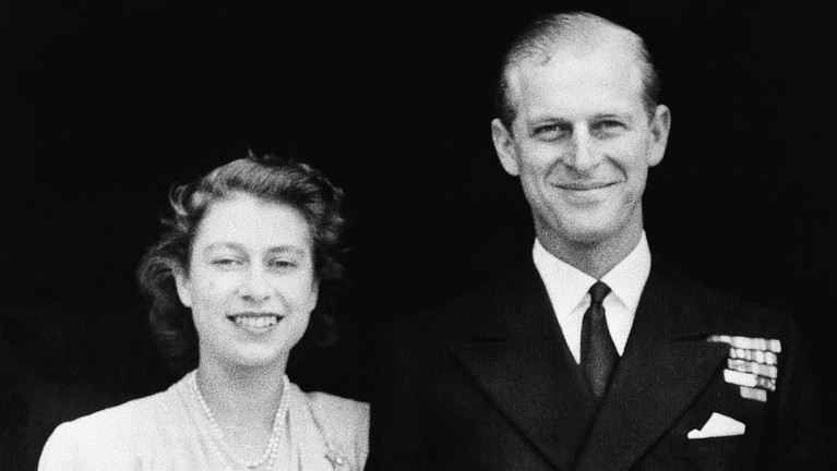 FILE - In this June 2, 1953 file photo, Britain's Queen Elizabeth II and her husband, the Duke of Edinburgh, wave from the balcony of Buckingham Palace, London, following the Queen's coronation at Westminster Abbey. Buckingham Palace says Prince Philip, husband of Queen Elizabeth II, has died aged 99. (AP Photo/Leslie Priest, File)