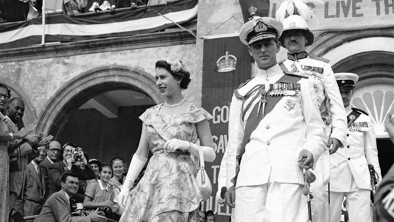 FILE - In this June 2, 1953 file photo, Britain's Queen Elizabeth II and her husband, the Duke of Edinburgh, wave from the balcony of Buckingham Palace, London, following the Queen's coronation at Westminster Abbey. Buckingham Palace says Prince Philip, husband of Queen Elizabeth II, has died aged 99. (AP Photo/Leslie Priest, File)
