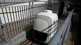 FOTO: Kurir Pengantar Barang Sudah Diganti Robot di Singapura Langkah mengganti kurir manusia dengan robot diharapkan bisa memanfaatkan lonjakan pengiriman yang meningkat sejak pandemi Covid-19.
