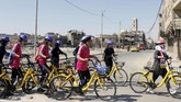 FOTO: Saat Perempuan Irak Ramai Bersepeda Kelilingi Mosul Sejumlah perempuan berpartisipasi dalam lomba maraton sepeda perempuan pertama di Irak.