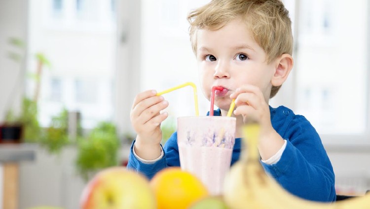Toddler enjoying Fruit Shake Smoothie