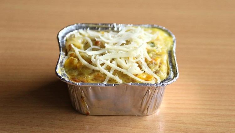 Macaroni schotel or macaroni casserole with wood background.