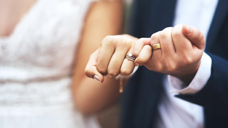 1181587386 Cropped shot of an unrecognizable newlywed couple doing a pinky swear gesture on their wedding day