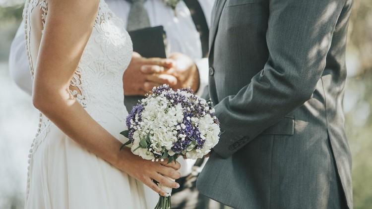 Cropped shot of an unrecognizable newlywed couple doing a pinky swear gesture on their wedding day