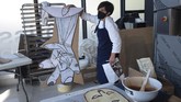 FOTO: Ketika Lukisan Guernica Picasso Menjelma Lewat Cokelat Perajin dari Basque memeringati pemboman Gernika dengan menghidupkan kembali lukisan Guernica Pablo Picasso dengan cokelat.