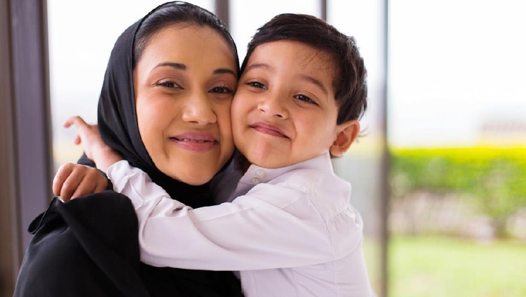 513384360 cute muslim boy hugging his mother