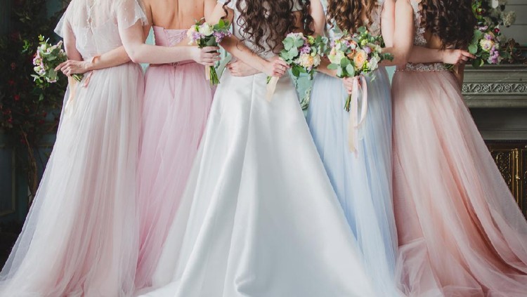 Beautiful young woman bride with friends. A wedding celebration, ladies in splendid dresses, Back view