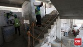 FOTO : Progres Proyek Kampung Susun Akuarium Era Anies Pada masa Anies Baswedan, Kampung Akuarium akan dikembalikan menjadi permukiman. Bangunan setinggi lima lantai diperuntukan untuk warga tinggal.