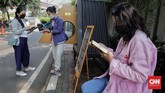 FOTO: Menyambangi Perpustakaan Bersama Bookhive Jakarta Para warga membaca buku di dekat perpustakaan bersama Bookhive Jakarta di kawasan Taman Situ Lembang, Jakarta, Selasa (27/4).