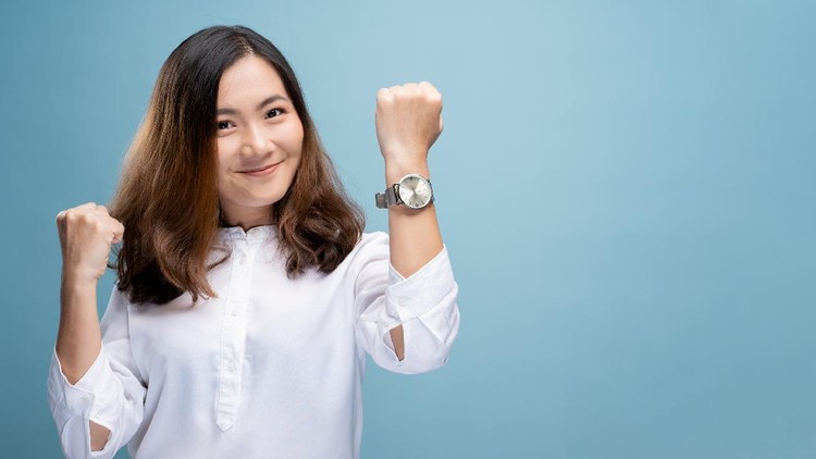 Head shot portrait grateful hopeful young woman holding hands on chest, pleased young female looking at camera, feeling love, gratitude, appreciation, thanking fate, isolated on studio background