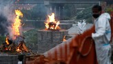 FOTO: Varian Covid-19 India 'Bermutasi' Sampai ke Nepal Varian corona dari India yang dapat bermutasi ganda sudah memasuki Nepal hingga membuat kasus Covid-19 di negara itu melonjak dalam beberapa waktu belakangan.