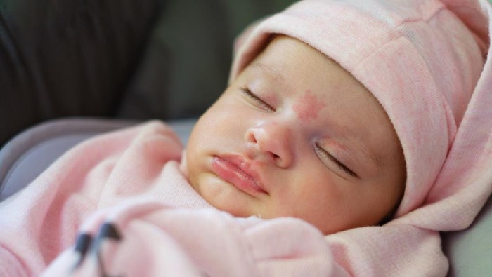 Beautiful two month old baby girl portrait while sleeping.