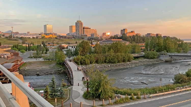 Ilustrasi Alaska Downtown Anchorage all aglow at midnight with Fish Creek