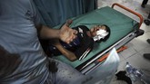 FOTO: Serangan Balasan Israel Bunuh 9 Anak Palestina Sebanyak 20 orang tewas termasuk sembilan anak-anak dalam serangan udara yang diluncurkan Israel ke Palestina, Senin (10/5).