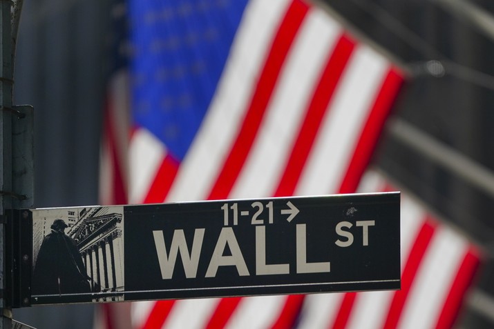 FILE - In this Oct. 14, 2020 file photo, the American Flag hangs outside the New York Stock Exchange in New York.Stocks were posting strong gains in early trading Thursday, May 13, 2021, following three days of losses and the biggest one-day drop in the S&P 500 since February.  (AP Photo/Frank Franklin II, File)