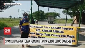VIDEO: Spanduk Warga Tolak Pemudik Tanpa Surat Bebas Covid-19