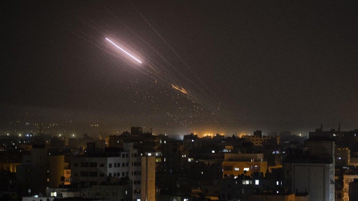 Rockets are launched from Gaza Strip to Israel, early Friday, May 14, 2021. (AP Photo/Khalil Hamra)