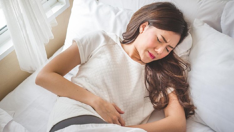 Asian woman stomachache, feel pain for period conceptAsian woman stomachache, feel pain for period concept
