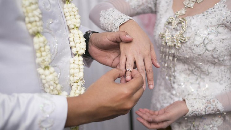 Pasang Cincin on Javanese Wedding. Traditional Javanese Groom Puts a Ring On The Bride