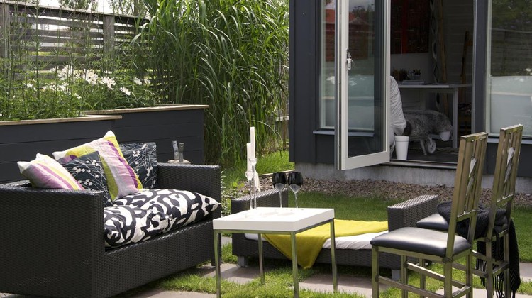 A beautiful modern Patio in front of a Garden Shed.