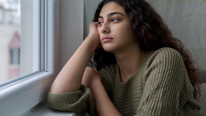 Young girl during session with her psychotherapist