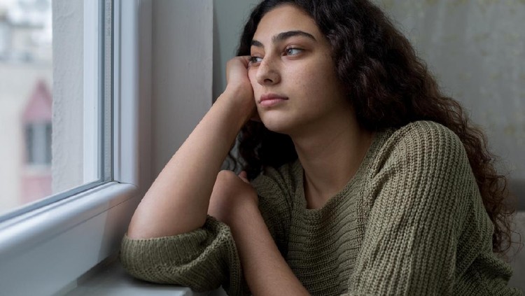 Young girl during session with her psychotherapist