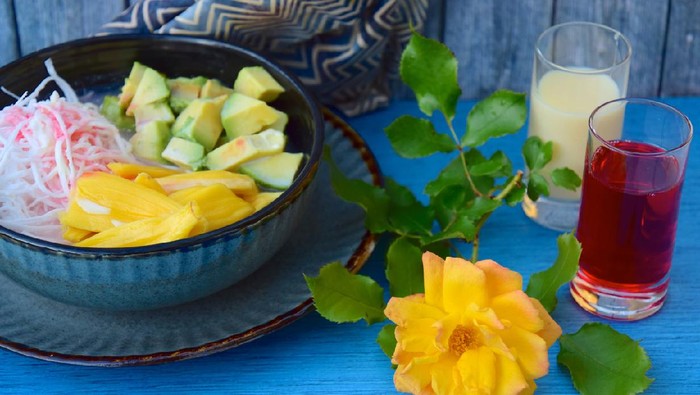 Es Teler is a fruit cocktail from Indonesia. Avocado, coconut meat and jackfruit served with coconut milk, sweetened condensed milk and syrup
