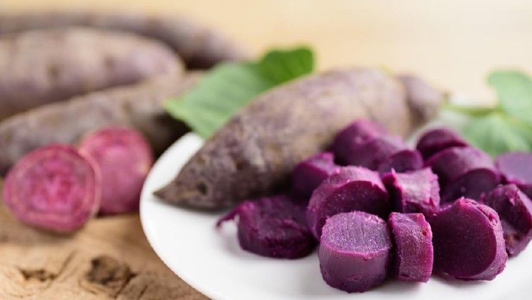 Sliced purple sweet potatoes on plate ready to eating, Healthy food