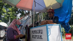 FOTO: Penjahit Keliling Menjemput Rezeki di Jalanan Ibu Kota