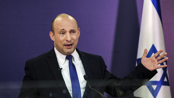 Naftali Bennett FILE - In this June 6, 2021, file photo, Naftali Bennett, Israeli parliament member from the Yamina party, gives a statement at the Knesset, Israel's parliament, in Jerusalem. If all goes according to plan, Israel will swear in a new government on Sunday, June 13, putting an end to Prime Minister Benjamin Netanyahu’s record 12-year rule and a political crisis that led to four elections in less than two years. The next government, which will be led by the ultranationalist Bennett, has vowed to chart a new course aimed at healing the country’s divisions and restoring a sense of normalcy. (Menahem Kahana/Pool via AP, File)