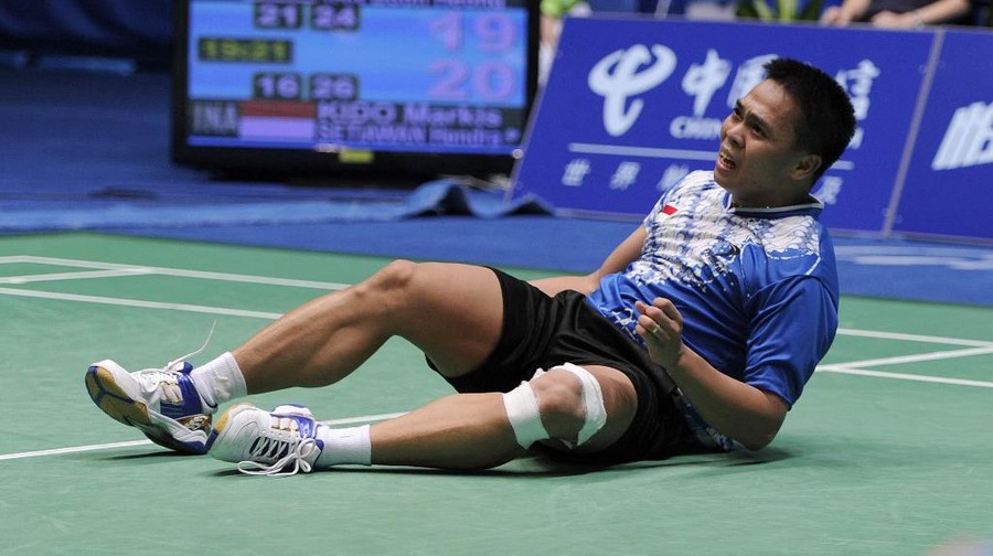 Markis Kido Markis Kido of Indonesia celebrates with his partner Hendra Setiawan (not pictured) after beating Koo Kien Keat and Tan Boon Heong of Malaysia during their men's doubles badminton final at the 16th Asian Games in Guangzhou on November 20, 2010. Indoneisa won 16-21, 26-24, 21-19 to take the gold. AFP PHOTO / LIU JIN (Photo by LIU JIN / AFP)