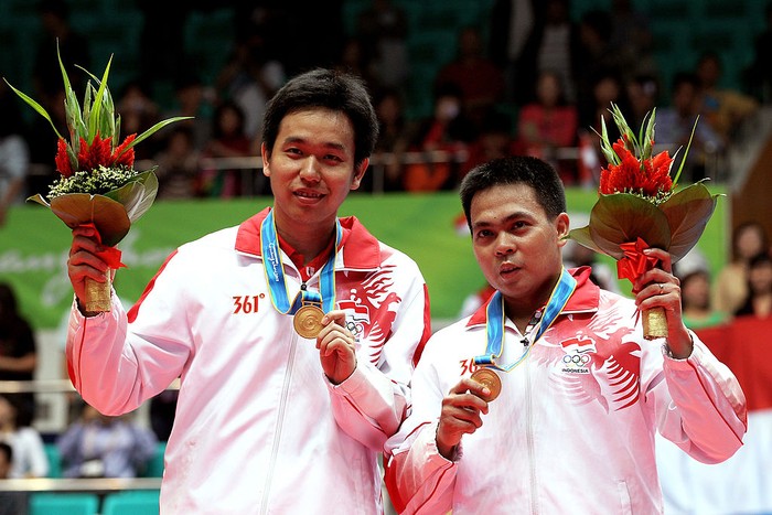 GUANGZHOU, CHINA - NOVEMBER 20:  Hendra Setiwan and Markis Kido of Indonesia pose with the gold medals won in the Men's Doubles Final Match at Tainhe Gymnasium during day eight of the 16th Asian Games Guangzhou 2010 on November 20, 2010 in Guangzhou, China.  (Photo by Mark Dadswell/Getty Images)