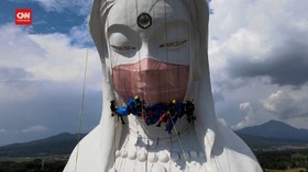 VIDEO: Patung Buddha Raksasa Gunakan Masker